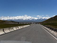 12C The Pamir Highway leads to Sary Tash with the broad snow-capped Trans-Alay Mountain Range beyond on the way to Lenin Peak Base Camp